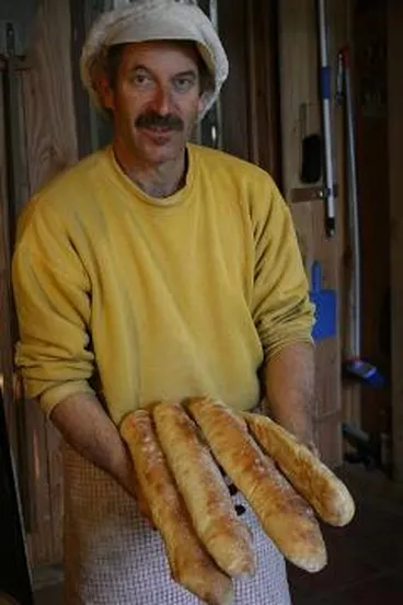 Image: Boly Bolliger holding bread sticks : digital image