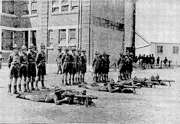 Image: Evening Post". Photo, TRAINING FOR CADETS.—Machine-gunners ready, for .action- during -the annual \ barracks of the ••• .- ■ • . ; Rongotai College cadets. '■'.-■- • . (Evening Post, 20 February 1935)