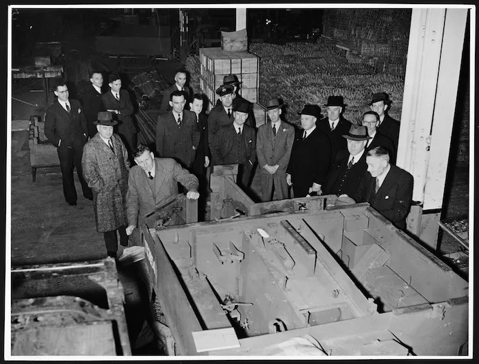 Parliamentary inspection of the production of Bren Gun Carriers at the General Motors plant, Petone, Wellington, during World War II - Photograph taken by the Evening Post