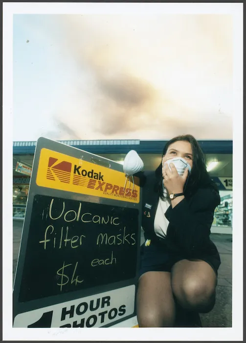 Tina Salvador from the Turangi Pharmacy sells filter masks to guard against volcanic ash during the Mount Ruapehu eruption - Photograph taken by Phil Reid