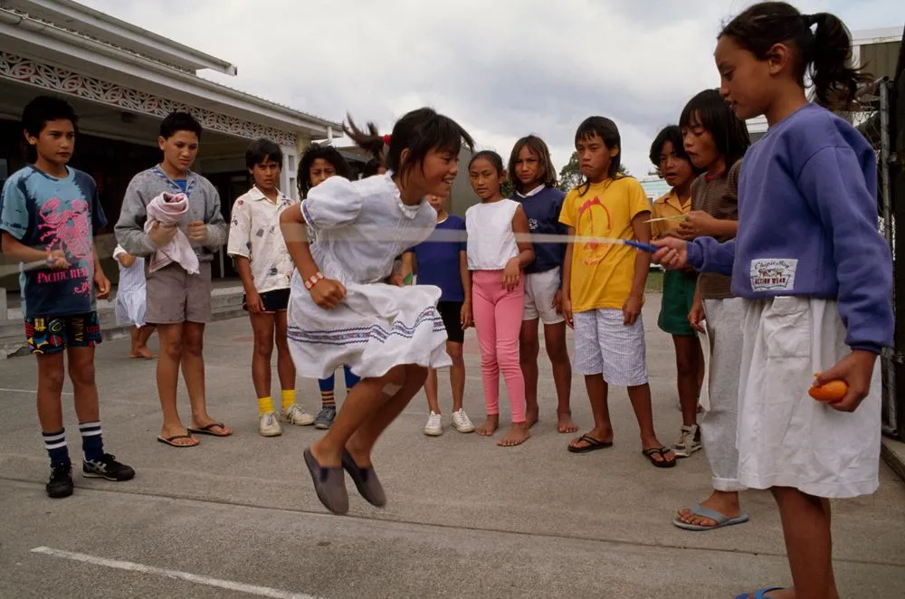 Maori children rope skipping