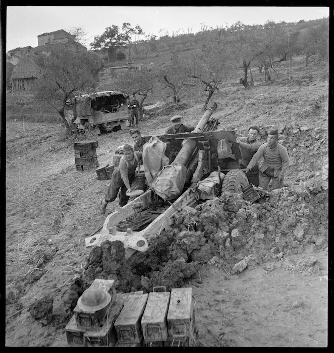 New Zealand soldiers winching a gun into a new position on the Sangro River front, Italy, during World War 2