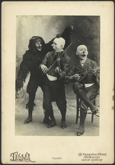 Image: Two clowns playing instruments and a monster - Photograph taken by Talma Studio