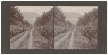 Image: Man with bike on gravel road