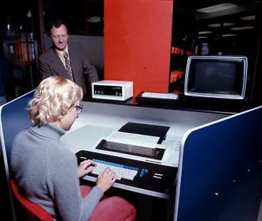 MacEwans Machinery Ltd, Trevor Burrell & Woman Image: MacEwans Machinery Ltd, Trevor Burrell & Woman