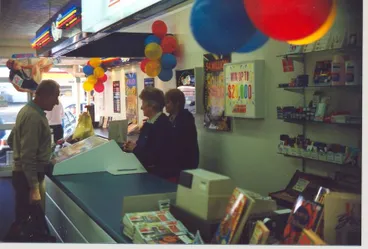Image: J. Gray serves customer Lotto shop
