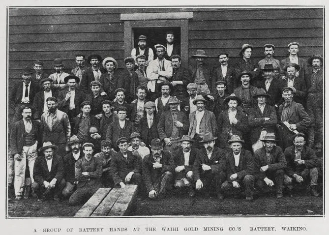 A GROUP OF BATTERY HANDS AT THE WAIHI GOLD MINING CO.'S BATTERY, WAIKINO