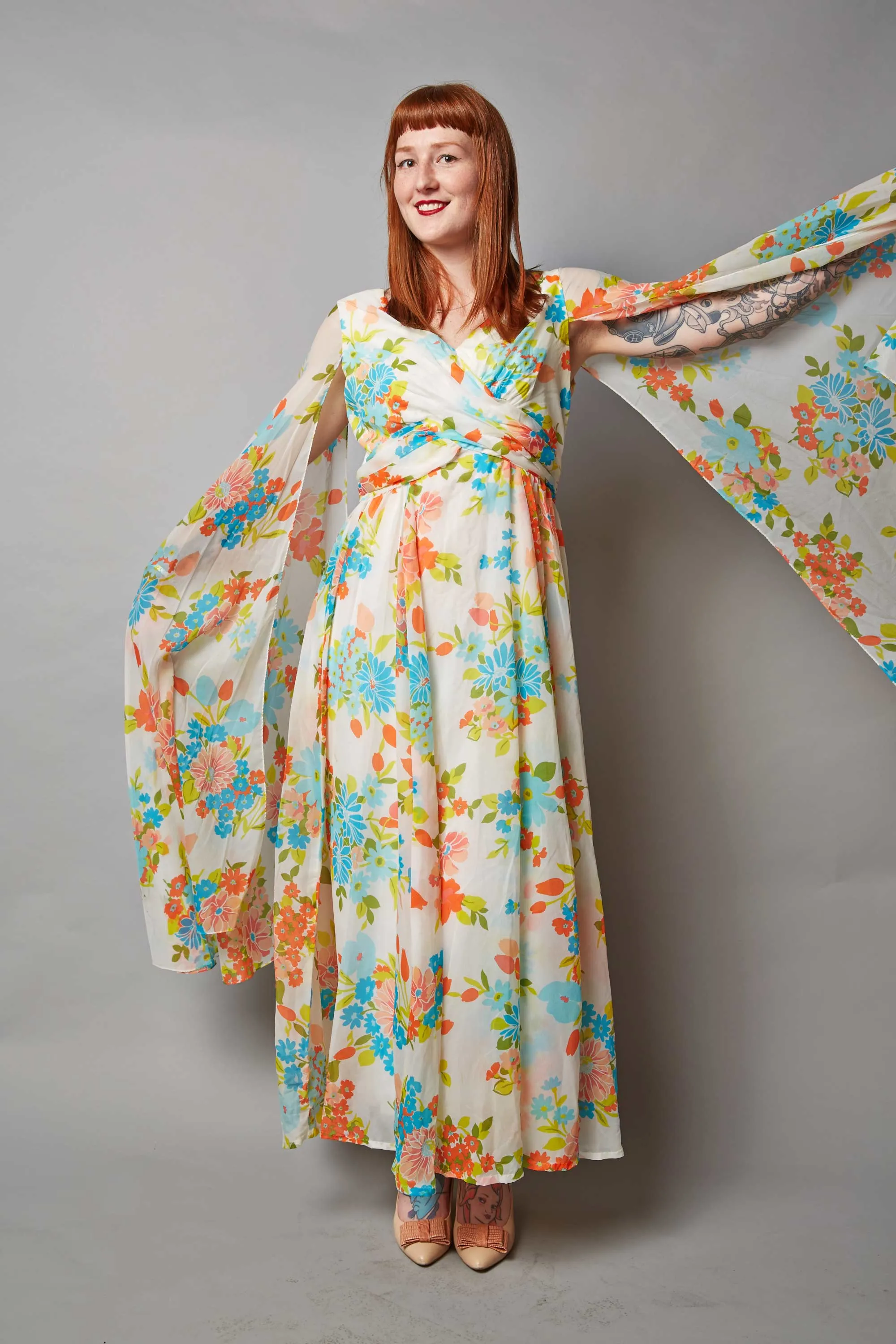 Dress with floating cap sleeves