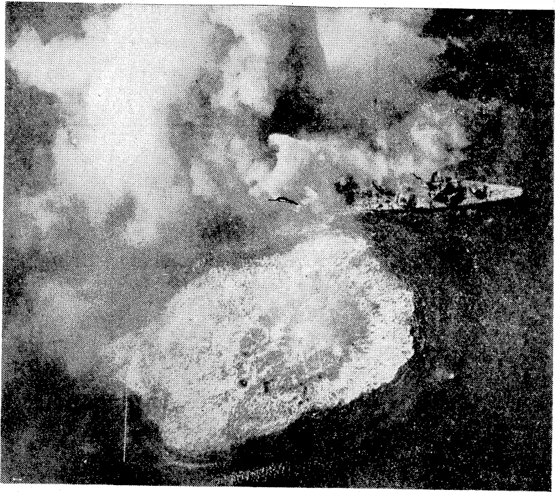 Carrier-based planes of the American Third Fleet found this and other Japanese transports near Mannduque Island, south of Luzon, on November 25 and blasted them well and truly. Dense clouds of smoke, are pouring from this Japanese transport a few seconds after a Helldivers bomb had smashed home. The circle of foaming water shows where one of the heavy bombs made a near miss. (Evening Post, 15 January 1945)