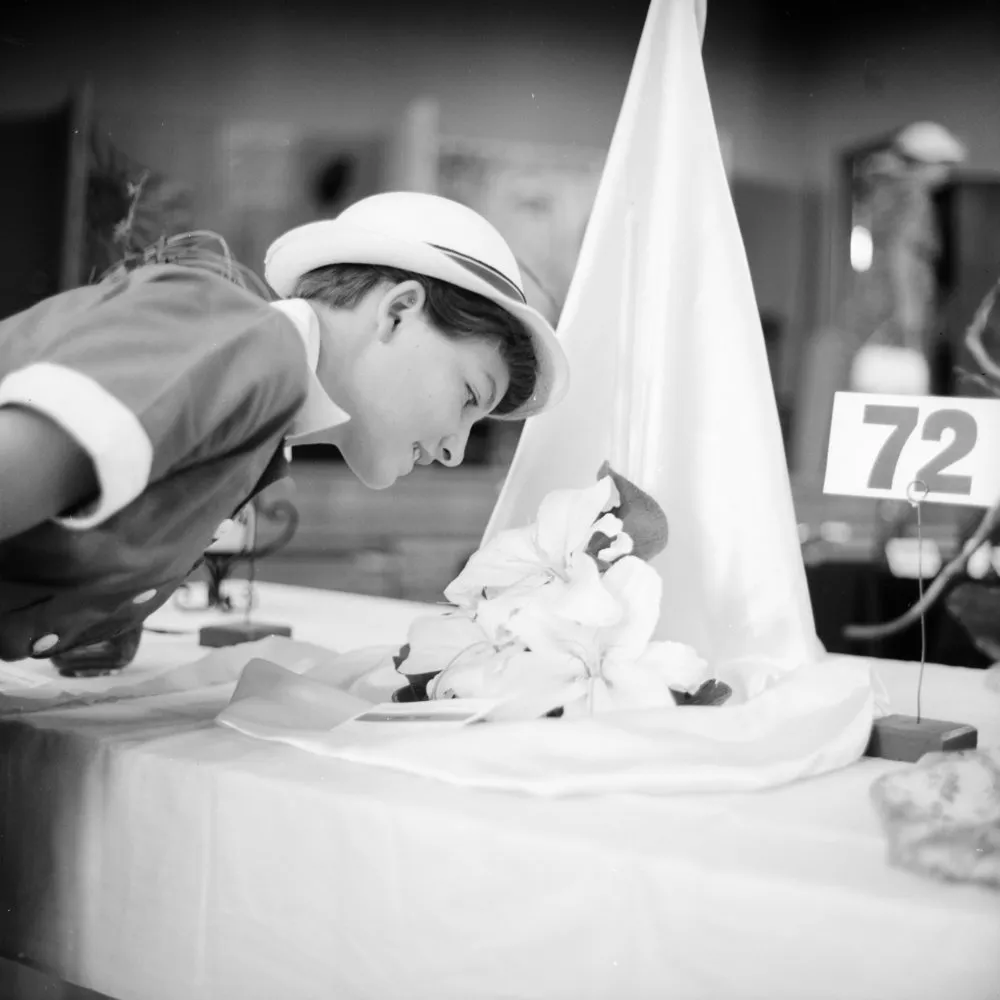 Lynette Corbett at flower show, 1961