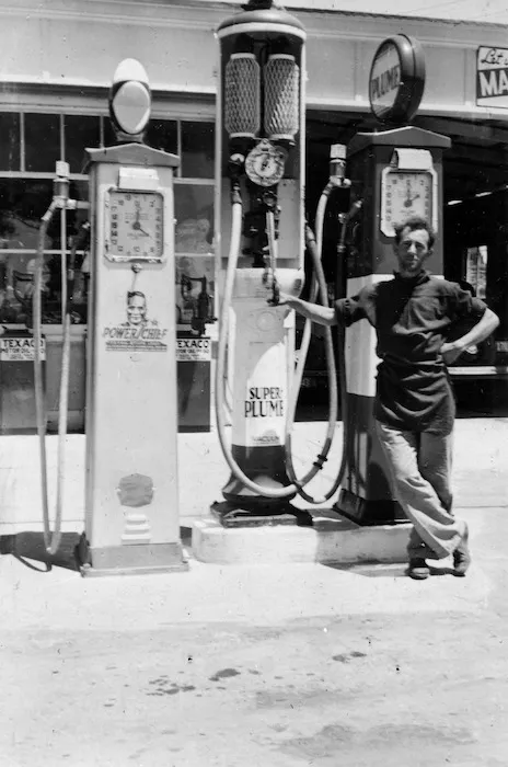 Petrol pumps and an unidentified man, at a service station