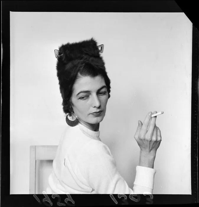 Unidentified woman modelling a hat