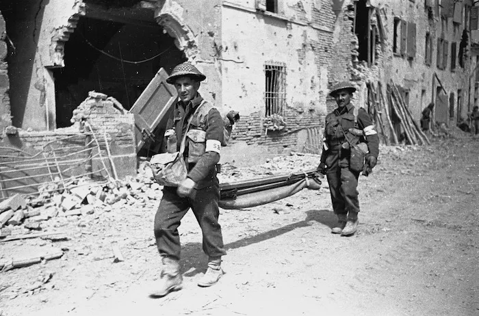 Kaye, George, 1914- : NZ stretcher bearers arrive in the Italian town of Barbiano shortly after its capture by NZ troops