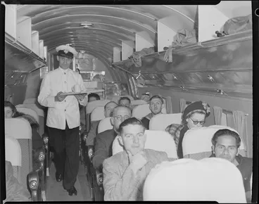 Image: National Airways Corporation steward, Fred Bennet carrying a food tray