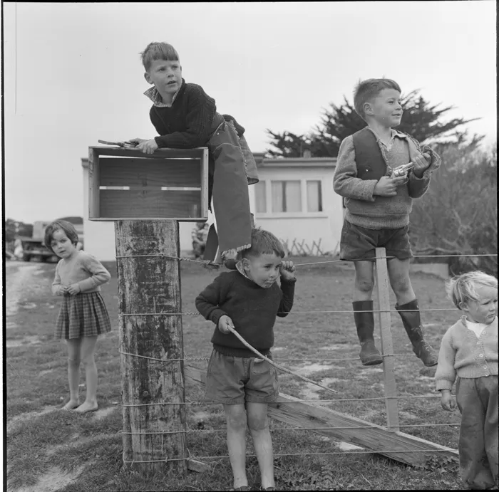 Young boys at Hongoeka Pa; driftwood