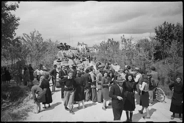 Image: NZ tanks driving northwards near Padova are warmly greeted by country people - Photograph taken by George Kaye