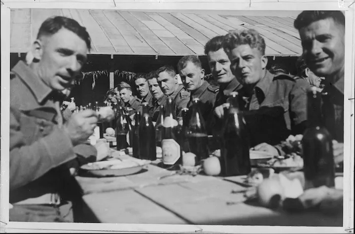 Christmas dinner in the open at NZ Base Reception Unit Maadi Camp, World War II - Photograph taken by H G Witters