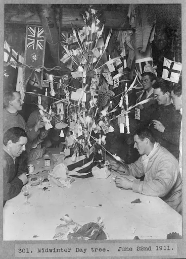 Image: Members of the British Antarctic Expedition of 1911-1913 around a Midwinter Day tree at Antarctica