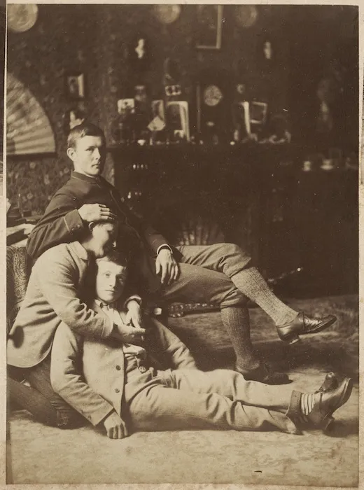 Three men in a sitting room