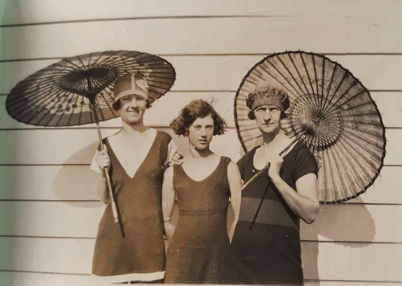 Three Ladies with Japanese umbrellas at Waihi Beach