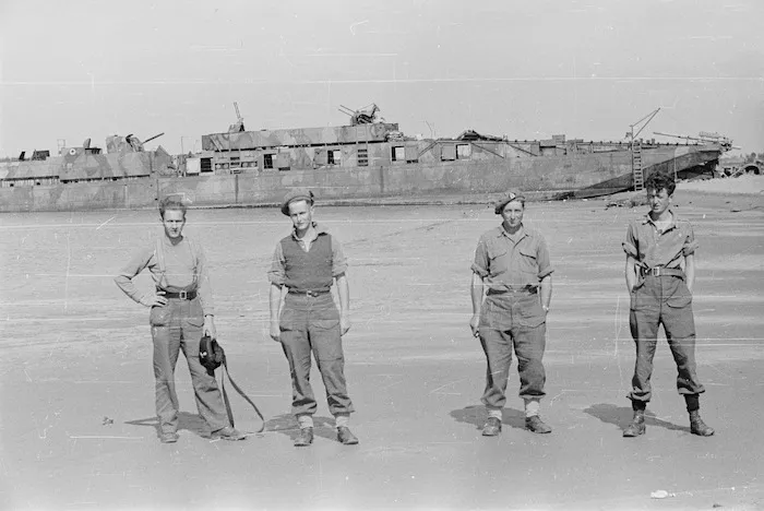 Members of 21 New Zealand Battalion with a surrendered German naval craft, near Lignano, Italy, during World War II
