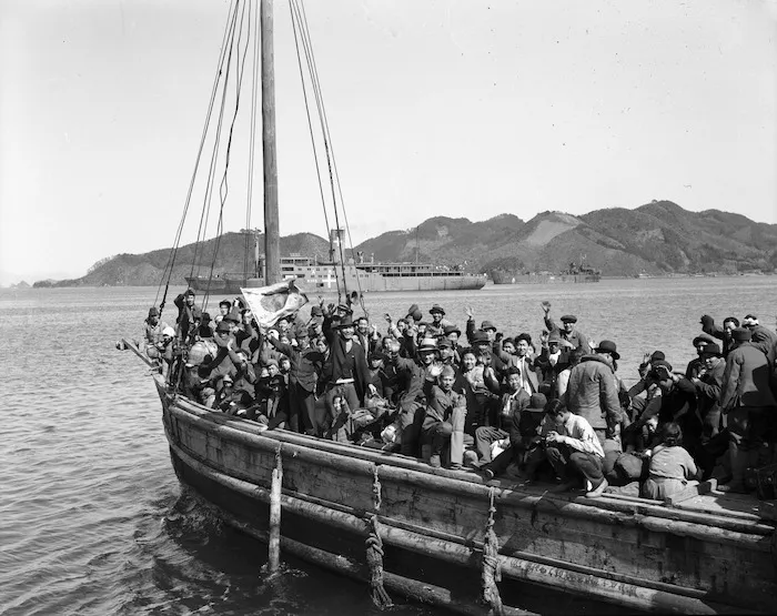 Japanese customs officers checking the baggage of Korean repatriates