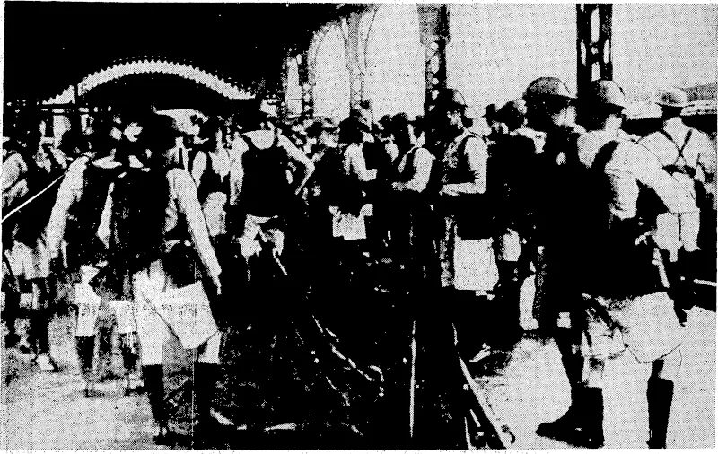 British1 marines are seen on the left guarding Garden Bridge during the fighting in Shanghai. V This bridge spans Soochow.Creek, and;is one of the important-traffic links of the .city. On wight,' Chinese refugees, with their belongings, moving into the International^ Settle. mentin search of shelter from the Japanese onslaught. (Evening Post, 07 September 1937)