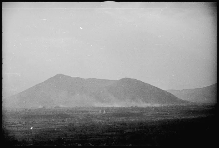 General view of Mount Trocchio seen through dust from enemy shelling, Italy, World War II - Photograph taken by George Kaye