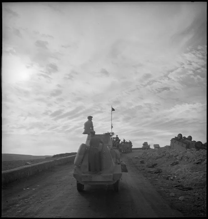 Convoy of armoured cars and portees moves up Sollum Hill, Egypt - Photograph taken by M D Elias