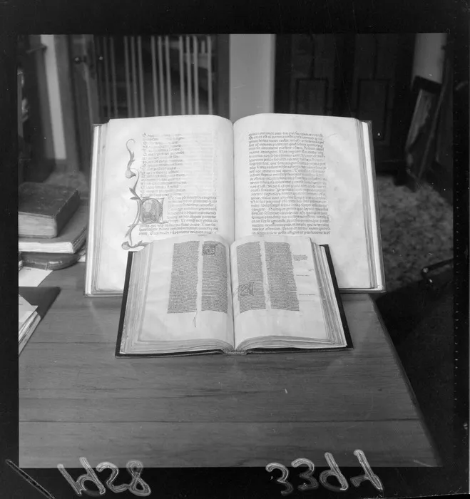 Display of illuminated manuscripts, with the item at the back being Boethius' Consolatio Philosphiae (Consolation of Philosophy) from the Alexander Turnbull Library collections