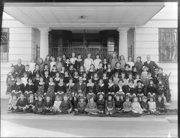 Image: Group of unidentified children and adults, most in Scottish Highland costume outside the Caledonian Hall, Christchurch