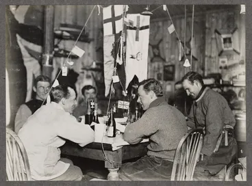 Image: Group of men sitting around a table in a hut, Antarctica - Photograph taken by G Murray Levick