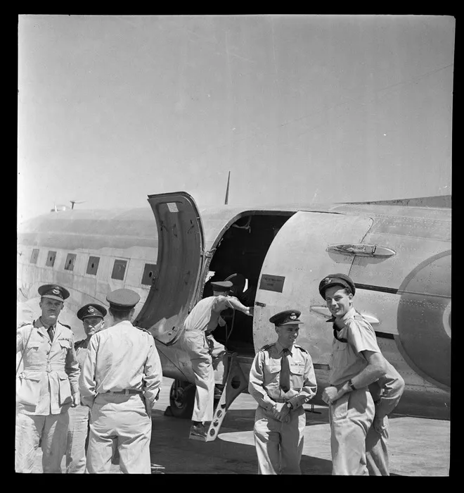 RNZAF survey flight to Japan, showing Squadron Leader R Gibbs, Wing Commander LH Parry, and Squadron Leader F Bethwaite, Whenuapai aerodrome, Auckland