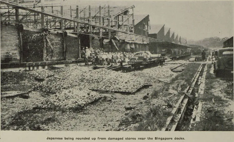 Japanese being rounded up from damaged stores near the Singapore docks