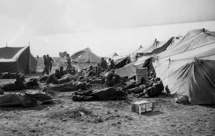 Wounded World War II prisoners of war alongside tents of the Main Dressing Station at Sidi Resegh, Libya