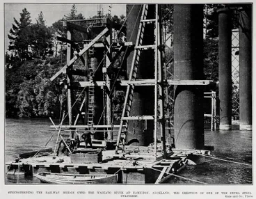 Image: STRENGTHENING THE RAILWAY BRIDGE OVER THE WAIKATO RIVER AT HAMILTON, AUCKLAND: THE ERECTION OF ONE OF THE EXTRA STEEL CYLINDERS