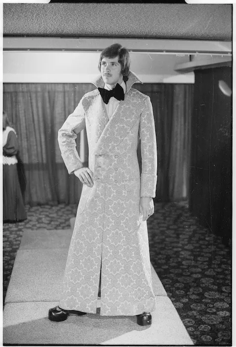 Philip Watkins models his Italian gold brocade full-length coat
