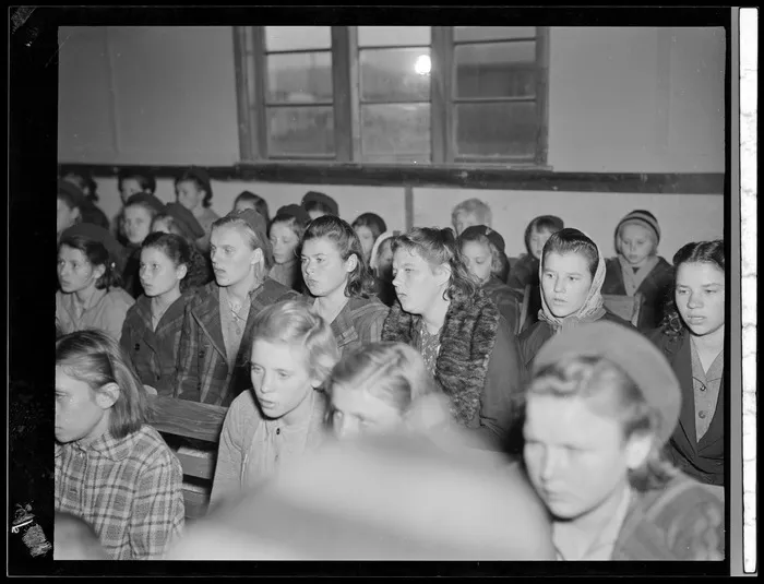 Girls sitting in auditorium (sala odczytowa) at Polish refugee camp, Pahiatua