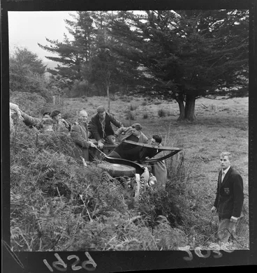 Image: Scouts assisting passengers escape a flipped car, at the site of an accident, Wainuiomata, Wellington