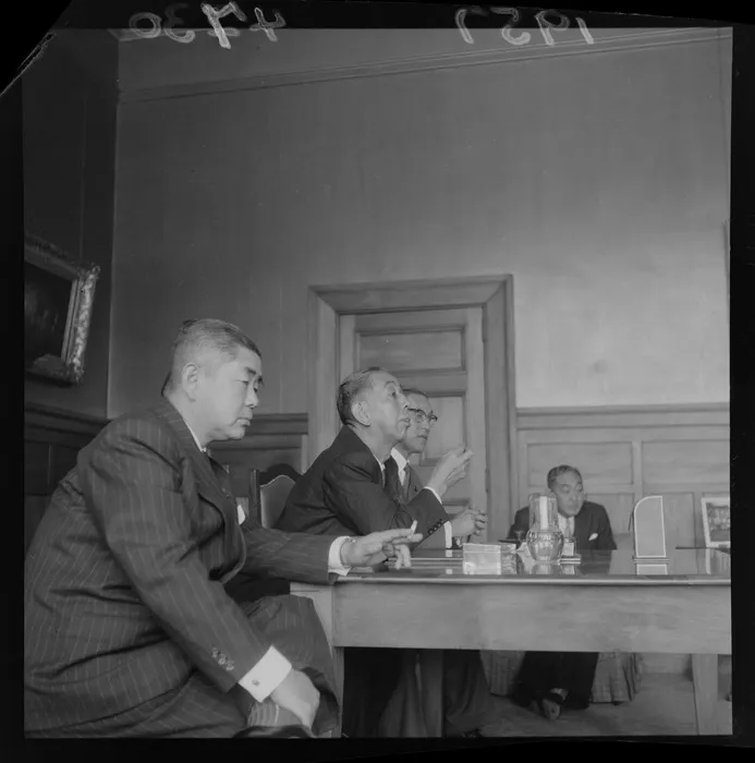 The Prime Minister of Japan, Mr Nobusuke Kishi, with officials