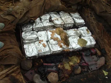 Image: Food trays in hangi.