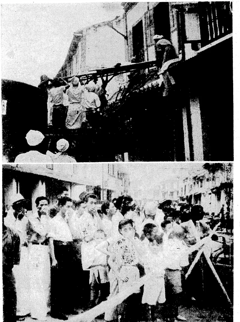 These pictures are from a Department of Information film taken during a recent Japanese air raid on Singapore. Top, removing wounded from a bombed house in the native quarter. Below, natives congregaled in a street during the raid. (Evening Post, 10 January 1942)