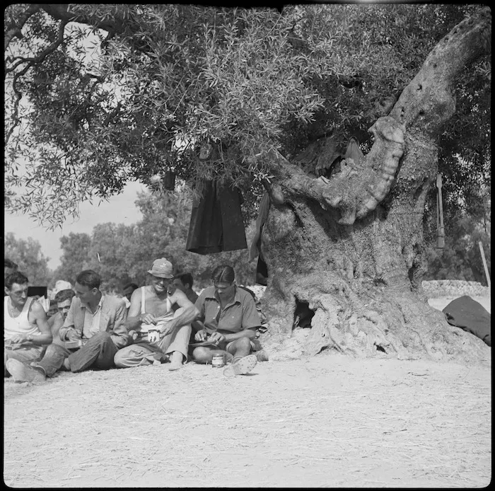 NZ escaped POW Private L W Dahm has a meal with a South African POW in the POW Sub Commission camp at Taranto, Italy - Photograph taken by W A Brodie