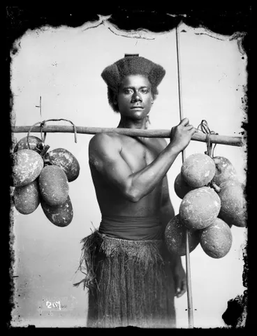 Image: Fijian man carrying breadfruit
