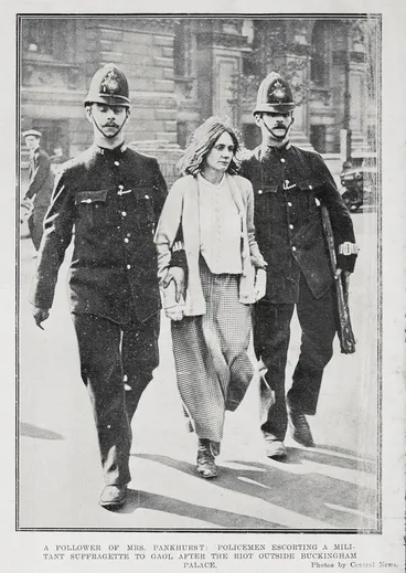 Policemen escorting a militant suffragette and follower of Mrs Pankhurst to gaol Image: Policemen escorting a militant suffragette and follower of Mrs Pankhurst to gaol