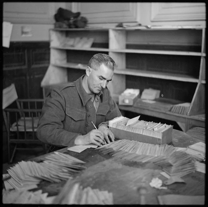 Checking addresses on greeting cables sent to troops from NZ, Egypt