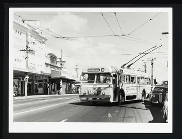Trolley bus 118 on route 9 Three Kings turning onto road with shops Image: Trolley bus 118 on route 9 Three Kings turning onto road with shops