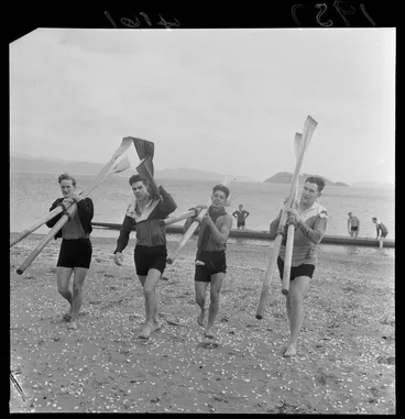 Image: Four unidentified rowers carrying oars, on beach at Petone, Lower Hutt City