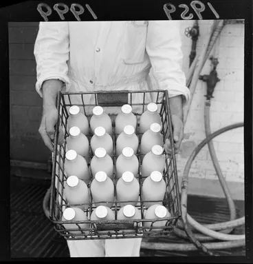 Image: A crate of bottled milk, in a factory, location unidentified