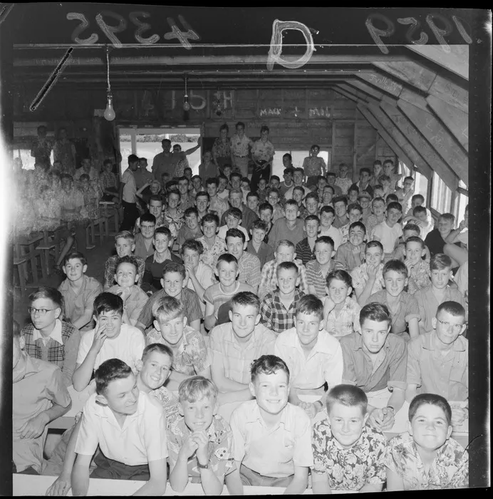 Boys in meeting hall at Boys' Brigade camp, Wainuiomata, Lower Hutt City, Wellington region